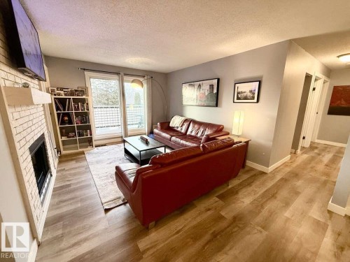 205 60 Alpine Place, St. Albert, AB - Indoor Photo Showing Living Room With Fireplace