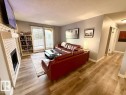 205 60 Alpine Place, St. Albert, AB  - Indoor Photo Showing Living Room With Fireplace 