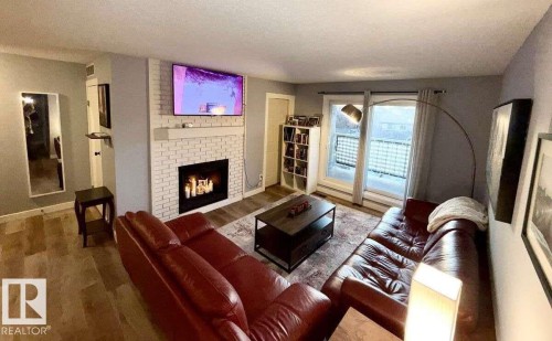 205 60 Alpine Place, St. Albert, AB - Indoor Photo Showing Living Room With Fireplace