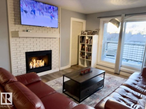 205 60 Alpine Place, St. Albert, AB - Indoor Photo Showing Living Room With Fireplace