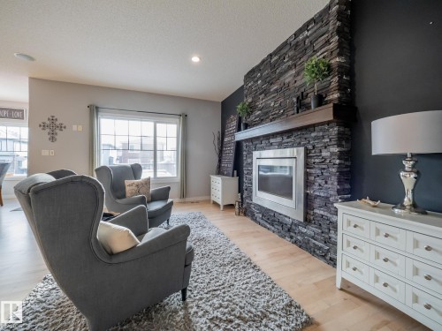 4211 Charles Close, Edmonton, AB - Indoor Photo Showing Living Room With Fireplace
