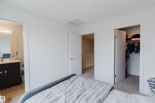Bedroom with light gray walls, white trim, and gray carpet - 3288 Keswick Way, Edmonton, AB - Indoor Photo Showing Bedroom