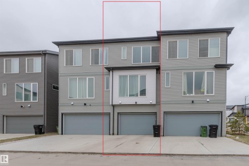 Contemporary three-story townhome with light gray siding and a flat roofline - 3288 Keswick Way, Edmonton, AB - Outdoor With Facade