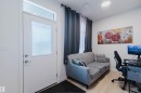 Entry with a frosted glass panel door and transom window, light wood-finish flooring, recessed ceiling lighting, and light-toned walls - 3288 Keswick Way, Edmonton, AB  - Indoor Photo Showing Other Room 
