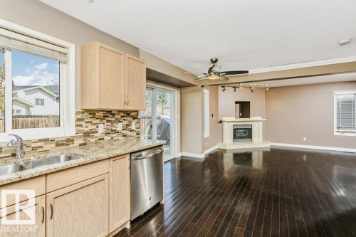 15827 133 Street, Edmonton, AB - Indoor Photo Showing Kitchen With Fireplace With Double Sink