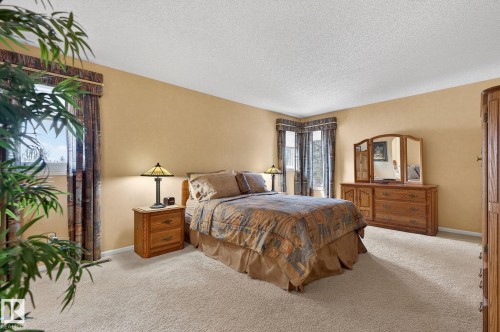 Spacious room featuring neutral carpeting and light-toned walls - 848 Wheeler Road W, Edmonton, AB - Indoor Photo Showing Bedroom