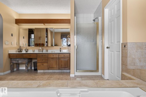 Ceramic tile flooring extending throughout the bathroom - 848 Wheeler Road W, Edmonton, AB - Indoor Photo Showing Bathroom