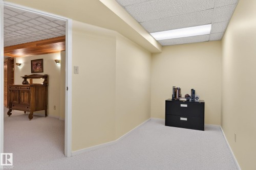 Recessed alcove featuring light-colored walls and wall-to-wall carpeting - 848 Wheeler Road W, Edmonton, AB - Indoor