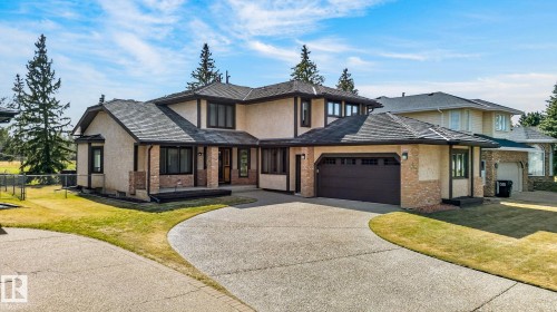 Spacious residence featuring a multi-level design, attached two-car garage, expansive driveway, and a combination of stucco and brick exterior finishes - 848 Wheeler Road W, Edmonton, AB - Outdoor With Facade