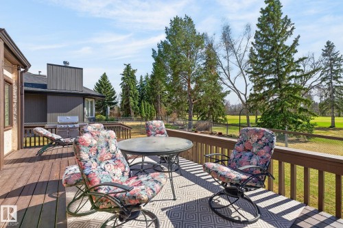 Expansive wood-finish deck with a wood railing system - 848 Wheeler Road W, Edmonton, AB - Outdoor With Deck Patio Veranda