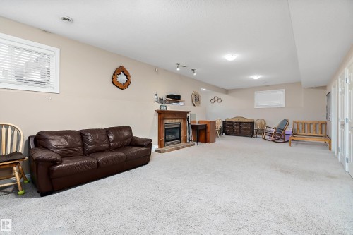 28 Woods Place, Leduc, AB - Indoor Photo Showing Other Room With Fireplace