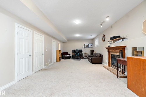 28 Woods Place, Leduc, AB - Indoor Photo Showing Other Room With Fireplace