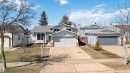 Siding exterior featuring a double-car garage and brick accents - 119 Dorchester Drive, St. Albert, AB  - Outdoor With Facade 