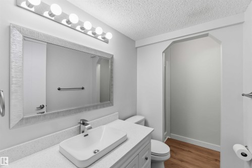 Modern vanity with white countertop and rectangular vessel sink - 119 Dorchester Drive, St. Albert, AB - Indoor Photo Showing Bathroom