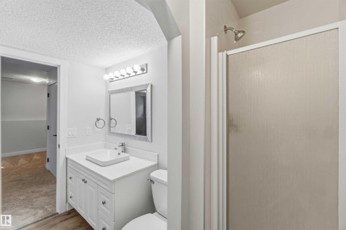 Bathroom featuring a single vanity with a white rectangular vessel sink and quartz-finish countertop - 119 Dorchester Drive, St. Albert, AB - Indoor Photo Showing Bathroom