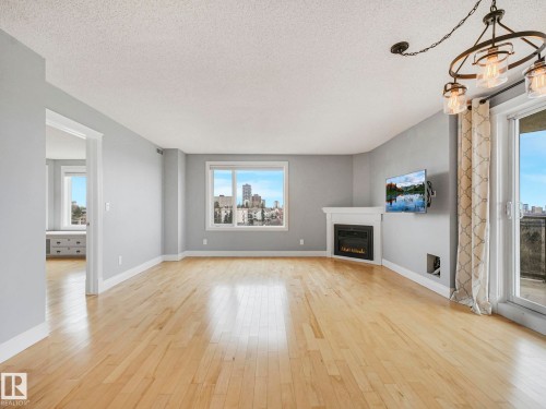 602 10649 Saskatchewan Drive, Edmonton, AB - Indoor Photo Showing Living Room With Fireplace