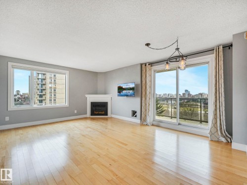 602 10649 Saskatchewan Drive, Edmonton, AB - Indoor Photo Showing Living Room With Fireplace