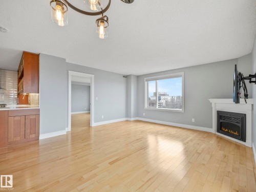 602 10649 Saskatchewan Drive, Edmonton, AB - Indoor Photo Showing Living Room With Fireplace