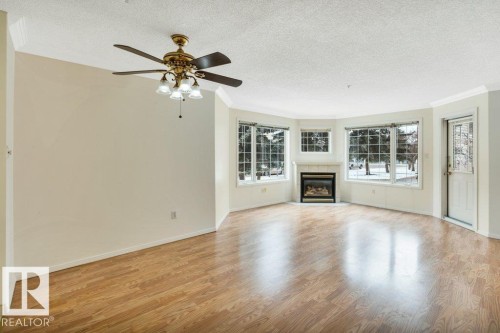 114 17150 94A Ave, Edmonton, AB - Indoor Photo Showing Living Room With Fireplace