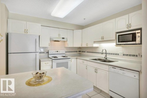114 17150 94A Ave, Edmonton, AB - Indoor Photo Showing Kitchen With Double Sink