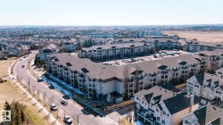 Large multi-unit residential building featuring multiple levels of balconies - 