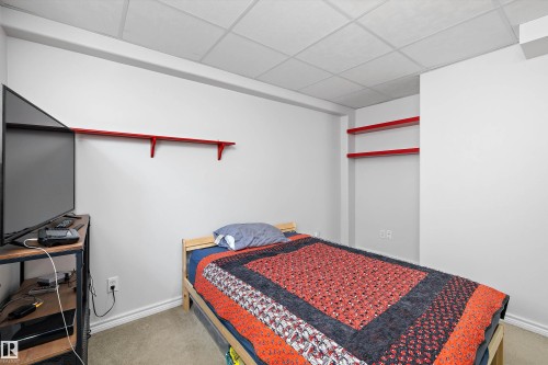 Room featuring light gray carpeting and white walls - 1811 37 Avenue, Edmonton, AB - Indoor Photo Showing Bedroom
