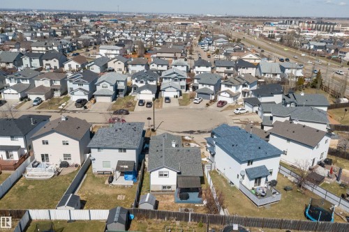 Suburban neighborhood featuring a collection of two-story homes with attached garages, asphalt shingle roofs, and fenced backyards - 1811 37 Avenue, Edmonton, AB - Outdoor With View