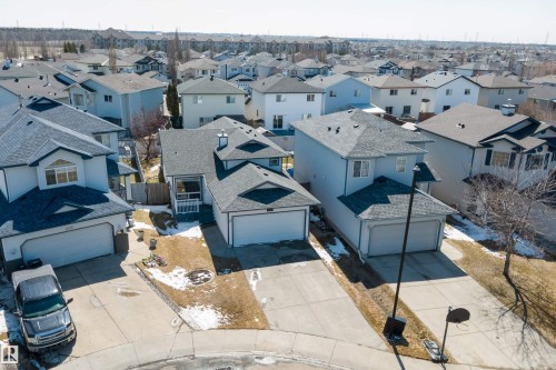 Residential neighborhood featuring multiple detached homes with attached garages, shingled roofs, and concrete driveways - 1811 37 Avenue, Edmonton, AB - Outdoor
