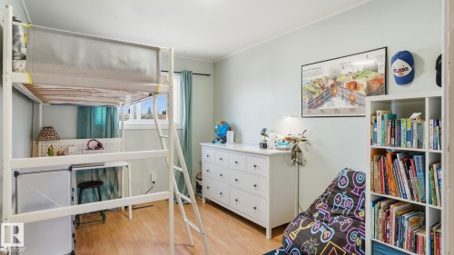 Room featuring light-toned walls and wood-finish flooring - 13533 119 Street, Edmonton, AB - Indoor