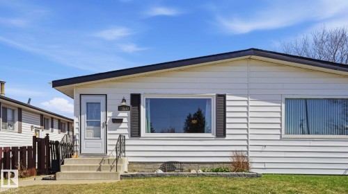 White siding exterior with a dark roofline - 13533 119 Street, Edmonton, AB - Outdoor