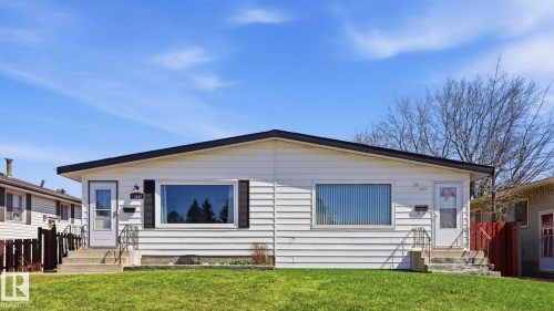 White siding exterior with a dark trim roofline - 13533 119 Street, Edmonton, AB - Outdoor