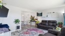 Open-concept living space featuring light gray walls, wood-finish flooring, and crown molding - 13533 119 Street, Edmonton, AB  - Indoor Photo Showing Living Room 