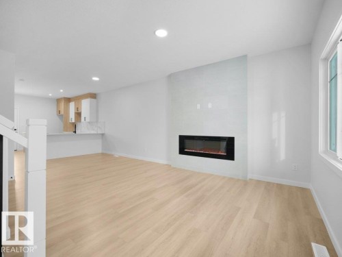 260 24 St Sw, Edmonton, AB - Indoor Photo Showing Living Room With Fireplace