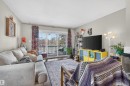 The living area features light-toned walls and dark-toned flooring - 2 Sturgeon Road, St. Albert, AB  - Indoor Photo Showing Living Room 