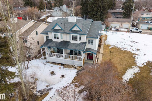 The property features a multi-level structure with a dark-colored roof and light-colored siding - 2 Sturgeon Road, St. Albert, AB - Outdoor