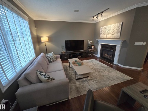 1668 Glastonbury Boulevard, Edmonton, AB - Indoor Photo Showing Living Room With Fireplace