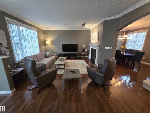 1668 Glastonbury Boulevard, Edmonton, AB - Indoor Photo Showing Living Room With Fireplace