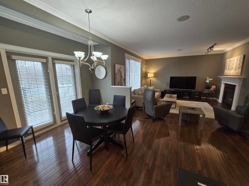 1668 Glastonbury Boulevard, Edmonton, AB - Indoor Photo Showing Dining Room With Fireplace