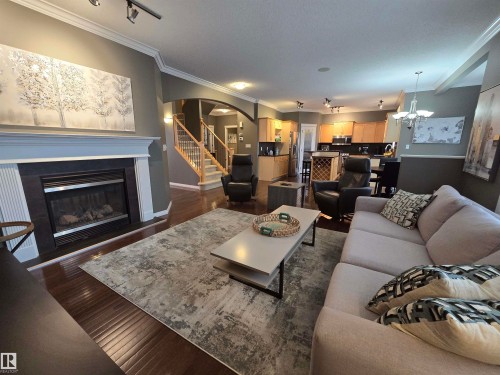 1668 Glastonbury Boulevard, Edmonton, AB - Indoor Photo Showing Living Room With Fireplace