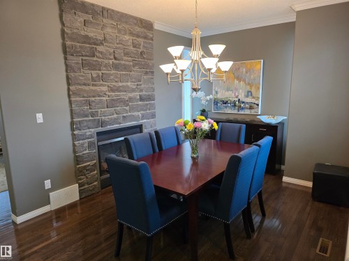 1668 Glastonbury Boulevard, Edmonton, AB - Indoor Photo Showing Dining Room With Fireplace