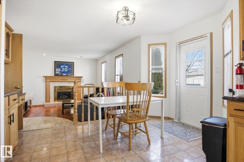 7220 157 Avenue, Edmonton, AB - Indoor Photo Showing Dining Room With Fireplace