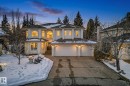 The property features a stucco exterior, a tiled roof, and an attached two-car garage - 1211 Hewgill Place, Edmonton, AB  - Outdoor 