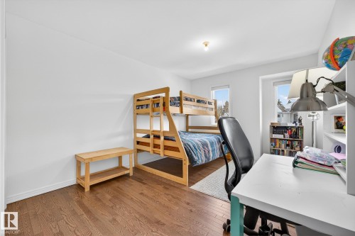 This room features hardwood floors and white walls, creating a bright and inviting atmosphere - 1211 Hewgill Place, Edmonton, AB - Indoor