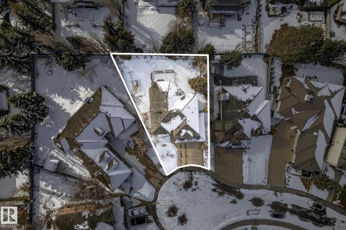 Aerial view of the property, featuring a multi-gabled roofline and an extensive driveway - 1211 Hewgill Place, Edmonton, AB - Outdoor With View