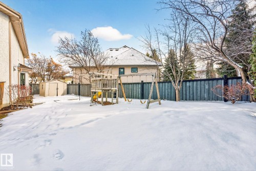 The property features a fenced yard, a storage shed, and mature trees - 1211 Hewgill Place, Edmonton, AB - Outdoor