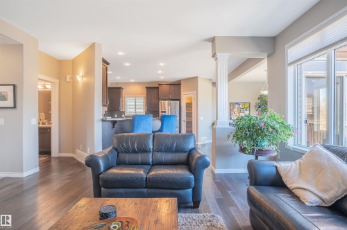 Open-concept living area with dark wood-finish flooring - 121 Ellington Crescent, St. Albert, AB - Indoor Photo Showing Living Room