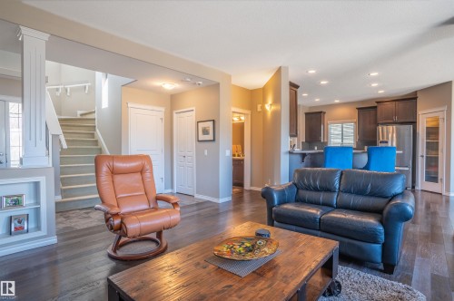 Hardwood-finish flooring throughout the main living area - 121 Ellington Crescent, St. Albert, AB - Indoor Photo Showing Living Room