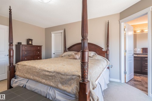 Carpeted bedroom with neutral wall tones and white trim - 121 Ellington Crescent, St. Albert, AB - Indoor Photo Showing Bedroom