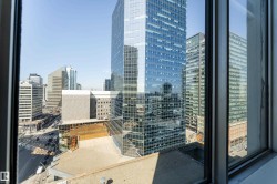 Urban cityscape panorama framed by a multi-pane window - 