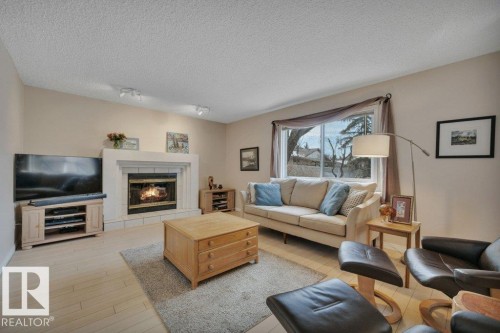 158 Rhatigan Road E, Edmonton, AB - Indoor Photo Showing Living Room With Fireplace